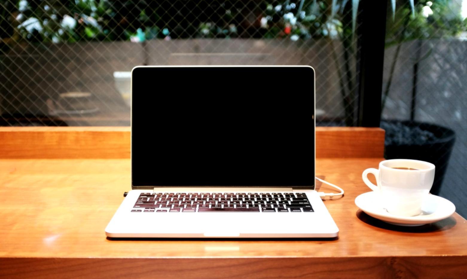 Students analyzing smart contract code on multiple monitors