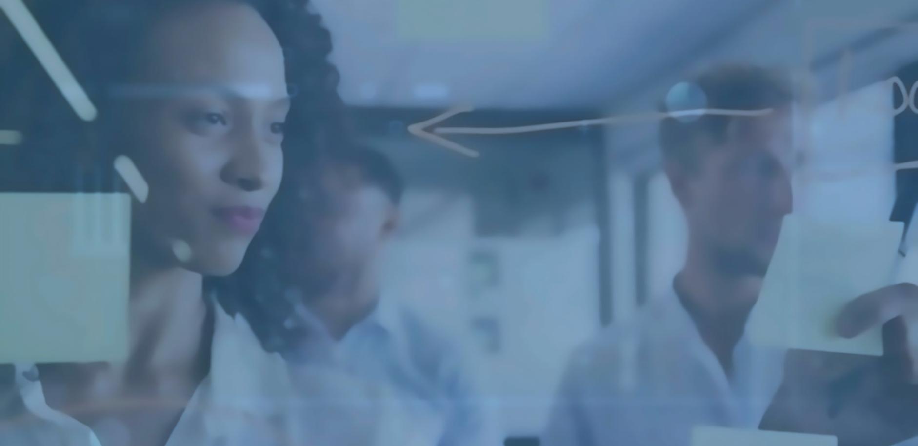 Development team reviewing blockchain implementation strategy